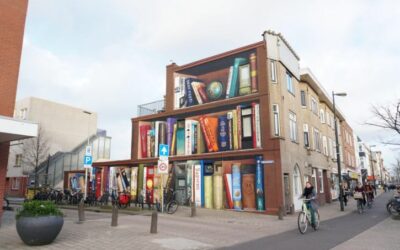 This optical illusion turned the side of a building into a massive book case