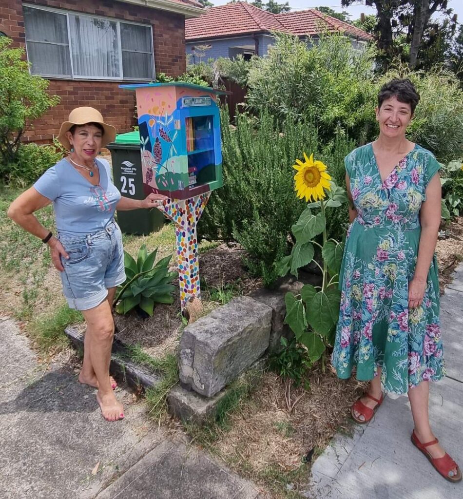 Two women with a Street Library