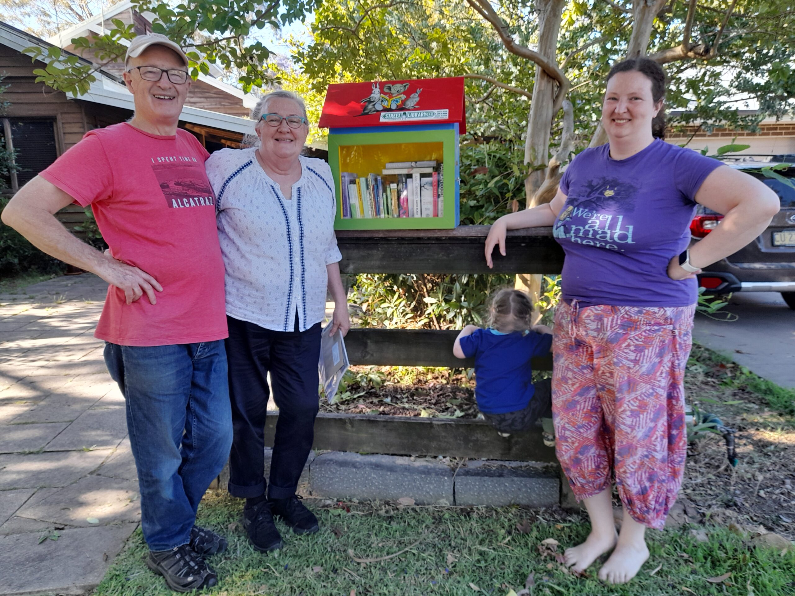 Members of the community with their Street Library