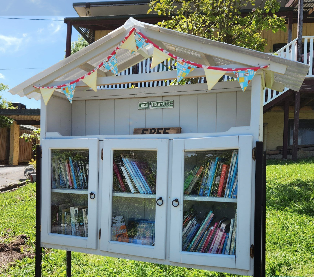 A Street Library with books inside.