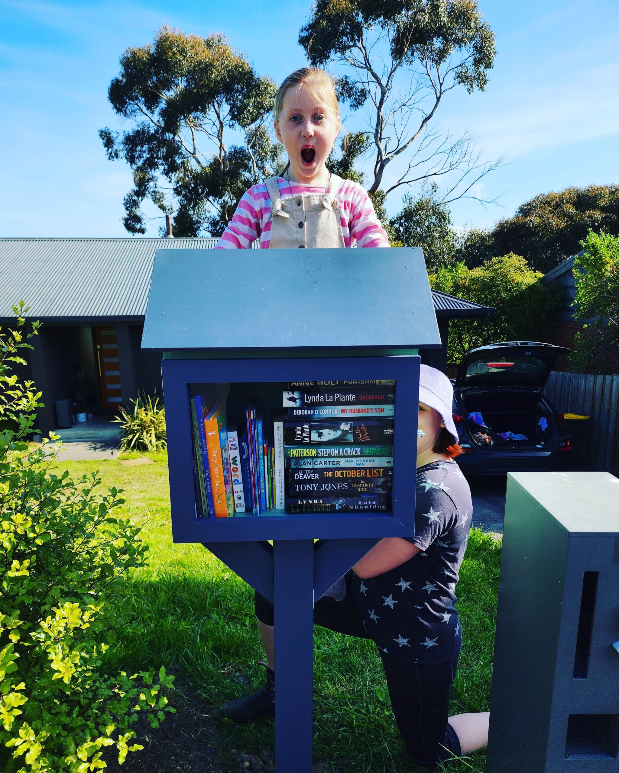 Two children enjoying their Street Library